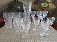 Front view showing all 15 crystal glasses including various types.