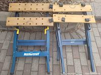 Two Mastercraft folding table saw stands with wooden tops and metal legs, showing layout and structure