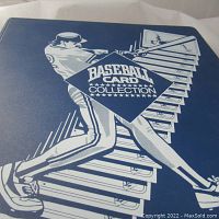 Front cover of blue vinyl binder with “Baseball Card Collection” text and player illustration