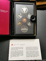 Full set of 7 proof coins in black presentation case with Royal Canadian Mint booklet also included