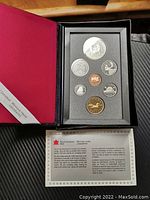 Full view of the 1988 Canadian proof coin set in display case with all coins visible and accompanying informational leaflet.