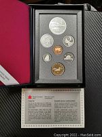 Overview of the complete 1991 Canadian Royal Canadian Mint proof coin set in black presentation case showing all seven coins and accompanying certificate.