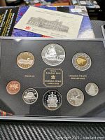 Full view of the 1999 Royal Canadian Mint silver proof coin set showing nine coins and display case.