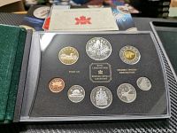 Full set of 7 coins from the Royal Canadian Mint 2000 proof set inside black protective case.