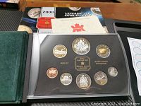 Full view of the Royal Canadian Mint 2000 Silver Proof Coin Set with coins visible inside protective plastic case along with outer folder and certificate.