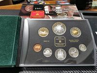 2001 Canadian Royal Canadian Mint silver proof coin set displayed in a black holder with 8 coins visible, including special edition dollar and other denominations with various designs.