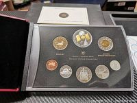 Photo of the Canada RCM 2005 silver proof coin set with nine coins displayed in protective case and black presentation box.