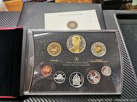 Full display of the 2007 Canada Royal Canadian Mint silver proof coin set with all eight coins in black presentation case with clear lid.