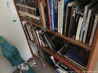 Full shelf view showing assorted art books and cookbooks
