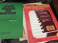 Photo showing Steps Toward the Masters piano book and Piano Chord Dictionary book covers.