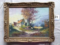 Full view of framed oil painting depicting rural landscape with house, trees, pathway, and signed lower right.