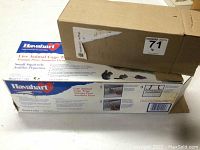 Boxes of Havahart Model 1025 Live Animal Cage Trap and Tomahawk Excluder in original packaging