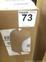 Closed, unopened cardboard box with MaxSold sticker labelled 73.