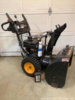 Side view showing overall machine, oil jug included in front
