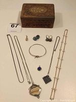 All items arranged around carved wooden box