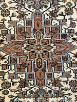 Close-up of central medallion pattern showing wool pile and color details