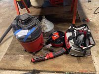 All items shown together: Shopvac, Snap-on work light, Bosch RotoZip in case, Snap-on extension cord.