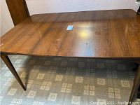Full view of walnut table surface and legs