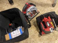 Photo showing Skil cordless circular saw with 7 1/4 inch blade, jigsaw and carrying case on floor with person's shoes visible at top edge.