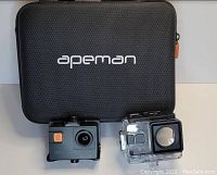 Image showing Apeman A87 camera, waterproof case, and carrying case against a plain background.