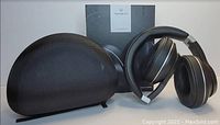 Black Vankyo C751 wireless headphones, carrying case, and product box displayed against white background.