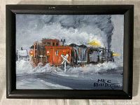 Front view of oil painting in black frame showing red caboose and locomotive under gray sky