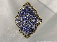 Top view of ring showing cluster of faceted tanzanite stones in an elongated marquise shape