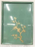 Front view of the green tray showing gold painted tree branch design, glossy finish, and slight edge raised.