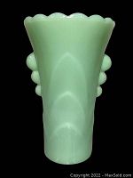 Front view of the vintage jadeite vase on black background, showing scalloped rim and bubble side decoration.