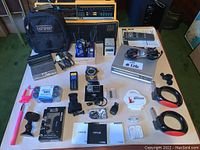 Full view of all electronics and accessories laid out on a table.
