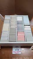 Large box holding approximately 3000 baseball cards, organized in rows, with dividers separating sections.