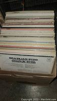 Top view showing multiple vinyl records in a box including the album Brazilian Byrd by Charlie Byrd