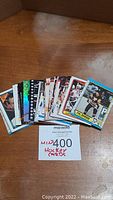 Photo showing a spread of approximately 50 hockey cards fanned out with visible different designs and colors
