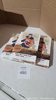 Three opened boxes of 2017-18 Upper Deck Series Two hockey cards showing box design with Connor McDavid image and orange/black graphics.