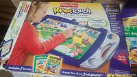 Box of Fisher Price Power Touch Learning System with child illustration and learning features on the packaging.