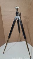 Full view of the Bergneustadt small collapsible tripod showing extended legs and metal construction