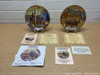 Photo showing two Ringling Bros. and Barnum & Bailey Circus collector plates on stands with certificates of authenticity and promotional literature around them.
