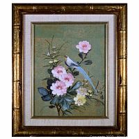 Front view of the acrylic painting showcasing the long-tailed bluebird and spring flowers inside a gold-toned bamboo style frame with fabric lining