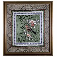 Frontal view of the embroidery of a red crested finch on flowering branch with detailed borders and gold-toned bamboo style frame with fabric lining.