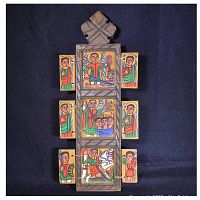 Front view of wooden triptych-style Ethiopian Coptic icon depicting St. Michael with colorful panels and hinged doors.