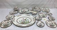 Full layout of multiple Indian Tree china pieces including serving platters, plates, saucers, covered serving dishes and a teapot