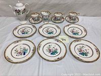 Full china set including teapot, cups with saucers, and salad plates