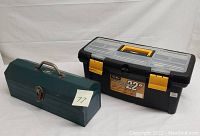 Photo showing two tool boxes: a green metal toolbox and a black-yellow 22-inch KIMAX plastic toolbox