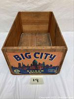 Full view of inside and front of wooden crate with vintage city skyline label and text 'Big City Suisun Bartletts'
