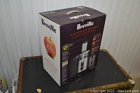 Box of Breville Juice Fountain Multi-Speed Juicer showing product branding and features