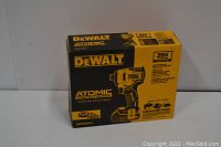 Front of DEWALT Atomic kit box showing model, torque rating and contents