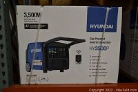 Original packaging of Hyundai HY3500P gas inverter generator showing front features and branding