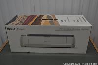 Front of sealed Cricut Maker box showing machine and branding