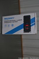 Box of Mileseey Professional Laser Distance Meter showing brand and product image