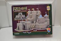 Front of box showing PUZZ 3D Camelot castle image and 620-piece count